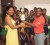 Vice President of the Guyana Netball Association, Shondel Samaroo right, accepts the first place trophy from Ramesh Sunich’s daughter, Emma Sunich.