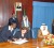 Minister of Foreign Affairs Carolyn Rodrigues Birkett (seated left) and Kuwait’s Minister of Trade and Industry Ahmad AL-Haroun (seated right) signing the agreement on bilateral trade. Looking on from left back row are: Director General in the Foreign Ministry Elisabeth Harper, President Bharrat Jagdeo and Kuwait PM Sheikh Nasser Mohammed Al Ahmed Al-Jaber Al Sabah. (GINA photo)