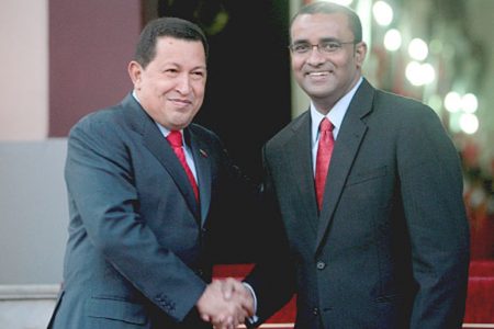 President Bharrat Jagdeo (right) greets President Hugo Chaves on Wednesday at Miraflores Palace. (Photo courtesy of GINA) 