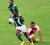 Guyana’s Dane ‘Sparks’ Parks breaks away from a diving Cayman Island’s defender yesterday at the National Stadium, Providence.