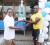 Winner of the veterans and open category races, Gary Benjamin (right) receives his silverware from  GBTI Branch Manager Naresh Balkaran.