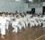 Eighth Dan black belt Master Frank Woon-A-Tai (left) leads the warm-up session, along with fifth Dan instructor Sensei Jeffrey Wong (in front), and the students of the GKC at the Malteenoes Sports Club dojo yesterday. (Orlando Charles photo)    