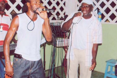 Supercat is given competition by another singer during a performance on the East Coast of Demerara recently.