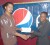 CATCHING THE SPIRIT! Trevor Rose, left, president of the Guyana Amateur Basketball Association receives a cheque for $1m from Pepsi Brand Manager Alexis Crawford on Friday.