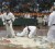 Romel Tameshwar (left) floors his opponent in the kumite. (Orlando Charles photo)    
