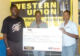 Marketing Manager of Grace Kennedy Remittance Services, Natheeah King (right) presents the cheque to national players Andrew Ifill (left) and Natasha Alder (centre) (Orlando Charles photo)