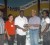 Sprinter, Kenneth Semple (third from left) receives the endorsement from TPL’s Manager of the Hardware Division, Mohan Harnandan. Also in the picture is Semple’s Coach John Martins, far left.