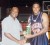 DC Jammers’ Lancelot Loncke (right) accepts the Most Valuable Player Award from Vice President of the Guyana Amateur Basketball Federation, Floyd Levi (Orlando Charles photo)
