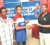 DDL representative Alicia Anderson (right) hands over the sponsorship cheque to RHTYSC Pepsi U-19 team captain Dominic Rickey while the club’s manager Patrick Lewis (left) looks on. 