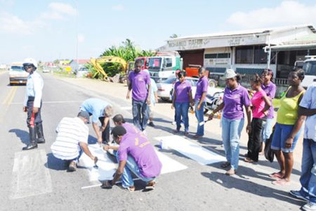 Young church members painting a pedestrian crossing at BV. As one of the Church’s anniversary  community projects