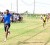 GTI’s Lawrence Phillips races to the finishing line with a massive lead in the boys’ Open 4x100m relay, yesterday. Carlwyn Collins can be seen fighting for his second place finish (photo by Orlando Charles).   