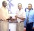 NAMILCO’s Finance Manager Autamaram Lakeram (centre) hands over the cheque to Fruta Conquerors’ Vice President Ivor Thompson while the President Marlan Cole (left) and members of NAMILCO look on.