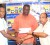 Managing Director of Comfort Sleep, Dennis Charran (Right) yesterday presented his company’s sponsorship cheque to Leon Moore (Left) and Kirk Clarke (Centre) (Orlando Charles Photo).