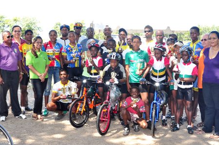 Prize winners at the 8th Annual Hand-in-Hand Insurance Company cycle programme pose with their prizes following yesterday’s race meet at the National Park. (Orlando Charles photo)