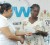 Minister of Human Services and Social Security, Priya Manickchand  presents a cheque to one of the 60 WOW beneficiaries.  (GINA photo)