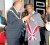 Suriname President Desi Bouterse bestowing Suriname’s highest national award, the Grand Officer in the Order of the Yellow Star, on CARICOM Secretary-General Edwin Carrington.
