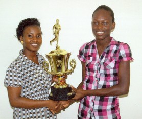 Chung’s Global Enterprise Secretary, Miriam Spooner (left) and former Nationals Championships Champion Girl Alika Morgan pose with the trophy. 