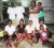 Sisters (sitting) of the dead man with their stepmother Lalita (seated at centre) and relatives of the other persons who were in the creek with Cleveland Hetemeyer. They were waiting patiently on the police to return yesterday with the body from up the Canje River.