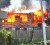 Fire eats away at one of the two houses in Golden Grove, East Coast Demerara yesterday.