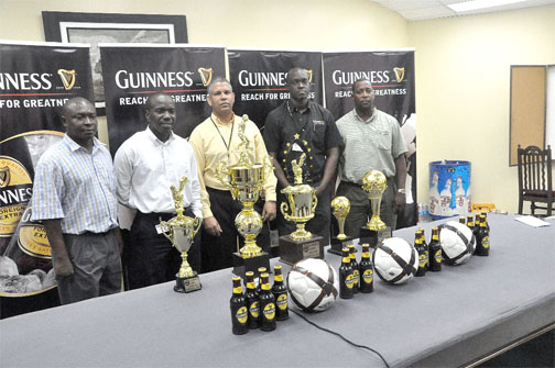 Banks DIH’s Sales and Marketing Manager, Carlton Joao (centre), Guinness Brand Manager, Lee Baptiste ((second right), Events Manager Mortimer Stewart (right), Public Relations Officer (PRO) Troy Peters  (left) and Marlan Cole (second Left) at the launching of the Guinness Greatest of the Street football competition, yesterday. (Orlando Charles photo)
