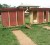 The outhouses that the 819 students of the Port Kaituma Primary School are using. The padlocked pit latrine to the left is used by the teachers.