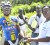 Walter Grant-Stewart (left) receives his winning trophy from a Demerara Distillers Limited representative after winning the Diamond Mineral Water cycle road race Sunday.