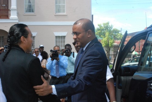 President Bharrat Jagdeo greets PNCR MP Mervyn Williams at Parliament Buildings today as he arrived for the viewing of Winston Murray’s body as it lay in state from 10:00 hrs to 12:30 hrs. (Photo by Jules Gibson)