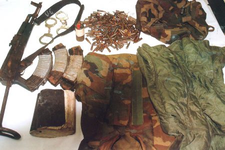 The arms, ammo and other items found by police. (Police photo)