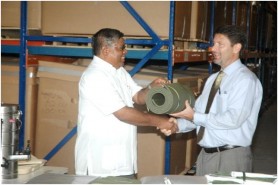 U.S Charge d’ Affaires Thomas Pierce (right) handing over the emergency relief items to Colonel Rtd and Chairman of the CDC, Chabilall Ramsarup at the Commission’s warehouse at Base Camp Stephenson, Timehri. (GINA photo) 