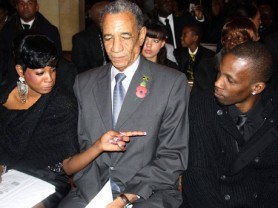 Gregory Isaacs' daughter Sandra makes a point to her brother Tommy (right), during a memorial service to celebrate the life of the singer at All Saints Anglican Church in Harrow Weald, London, yesterday. At centre is Jamaica's high commissioner to the United Kingdom, Anthony Johnson, who paid tribute on behalf of the Government of Jamaica and the Jamaican community in the UK. JIS photo