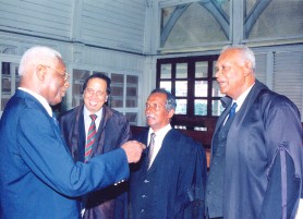 Winston Murray (second from right) at the High Court with (from left) late President Desmond Hoyte, Ronald Luckhoo and Rex McKay.