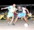 Two players battle for possession of the ball in the Guinness Greatest of De Street Futsal tournament on Tuesday night at the National Park tarmac. (Orlando Charles photo)