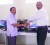 Regional Chairman Ali Baksh (left) receiving the computers from Project Manager Michael Singh