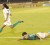 National Under-20 player, Ron Fiedtkou goes down after a challenge from  his Linden counterpart in the exhibition match on the opening night of the Kashif and Shanghai tournament.