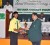 Amir Khan receives his junior Cricketer-of-the-Year award from GCB president Chetram Singh. (Orlando Charles photo)