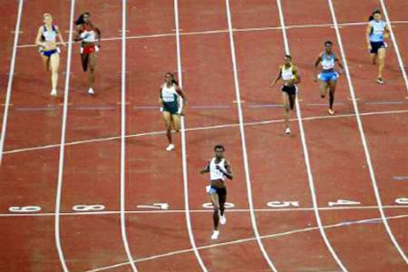 FLASHBACK! Guyana’s Aliann Pompey crosses the finish line in third position in the women’s 400m final at the Commonwealth Games in India. Pompey’s bronze medal was later upgraded to silver after Nigeria’s Folashade Abugan was stripped of the silver medal.