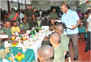 President Bharrat Jagdeo serving meals to officers of the Guyana Defence Force (GINA photo)