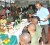 President Bharrat Jagdeo serving meals to officers of the Guyana Defence Force (GINA photo)