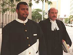(File Photo October 8th, 2008) Ramnaresh Katwaru (Left) leaves court with his lawyer.