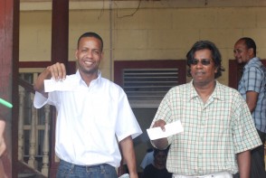 Mark Benschop (left) and Freddie Kissoon with their bail receipts