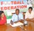 Deal!!! GFF President Colin Klass (centre) signs the sponsorship contract while Plus One Marketing Representative Donna Wilson (left) and GFF General Secretary Noel Adonis (right.