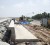Workers of M&B Construction Company continued work yesterday on a 60-metre long wall that will fortify existing sea defences at Turkeyen. The area is usually flooded during high tides. See story on page 15. 