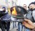 Rioters burn a policeman’s hat during clashes with the police in downtown Tunis yesterday. (REUTERS/Zohra Bensemra)