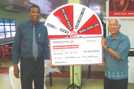 Ronald McGarrell (left) with his cheque