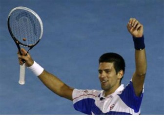 Novak Djokovic of Serbia celebrates his victory over Roger Federer of Switzerland during their semi-final match at the Australian Open tennis tournament in Melbourne yesterday. REUTERS/Mick Tsikas 