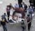 Protesters carry a carpet with an image of Egypt’s President Hosni Mubarak, with a shoe placed on it, in Suez on Friday. (REUTERS/ Mohamed Abdel Ghany)