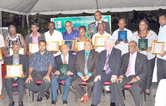 Awardees at Saturday evening’s Guyana Olympic Association (GOA) appreciation and awards ceremony pose for a photo op with Minister of Culture, Youth and Sport, Frank Anthony (second left sitting), President of the GOA, K Juman Yassin (third right sitting) and guest speaker, Ian McDonald (second right sitting) (Orlando Charles photo)