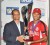 rinidad and Tobago captain Daren Ganga (right) receiving the Caribbean Twenty20 trophy from WICB president Dr Julian Hunte. (Barbados Nation photo)