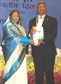 Ashok Kumar Ramsaran (right) receiving his award from India's President Pratibha Patil yesterday.