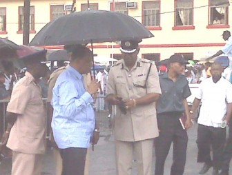 Home Affairs Minister Clement Rohee (left) and Police A Division Commander George Vyphuis at the scene.